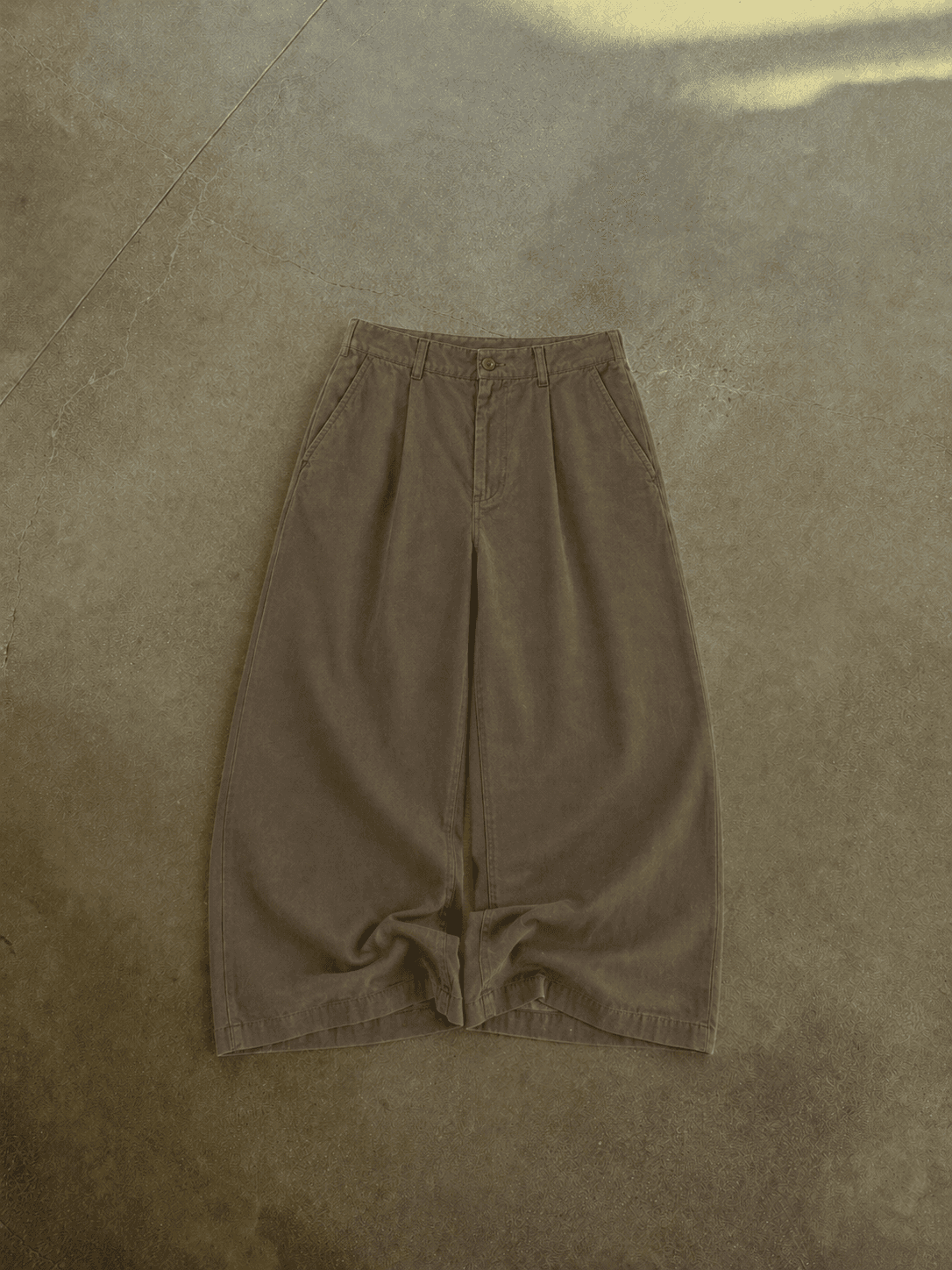 Brown pants on a textured brown surface