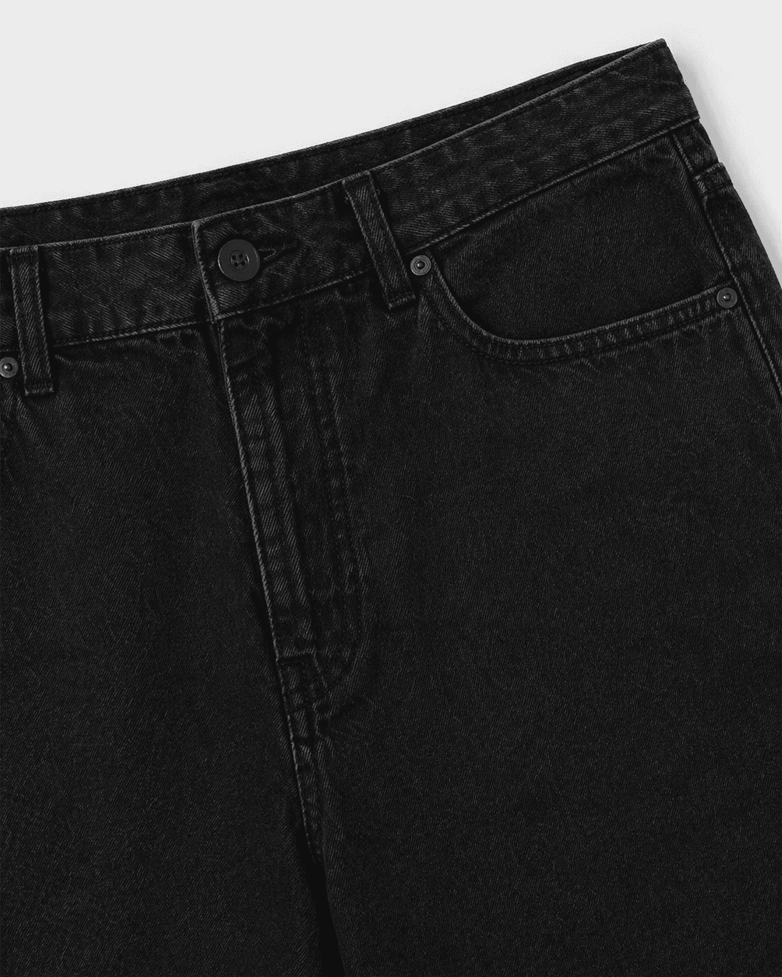 Close-up of a black t-shirt collar on a white background